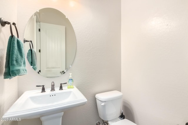 bathroom with a sink and toilet