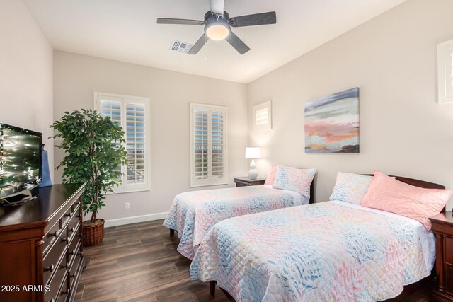 bedroom with baseboards, dark wood-style flooring, and ceiling fan