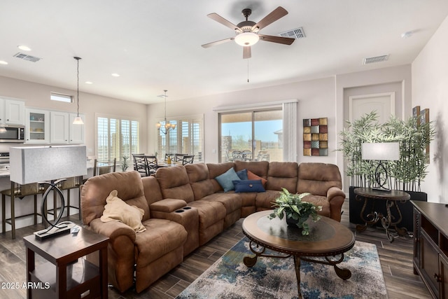 living area with recessed lighting, ceiling fan, and dark wood-type flooring