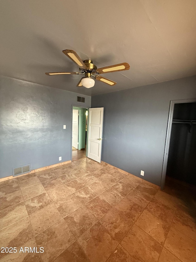 unfurnished bedroom featuring visible vents and a ceiling fan