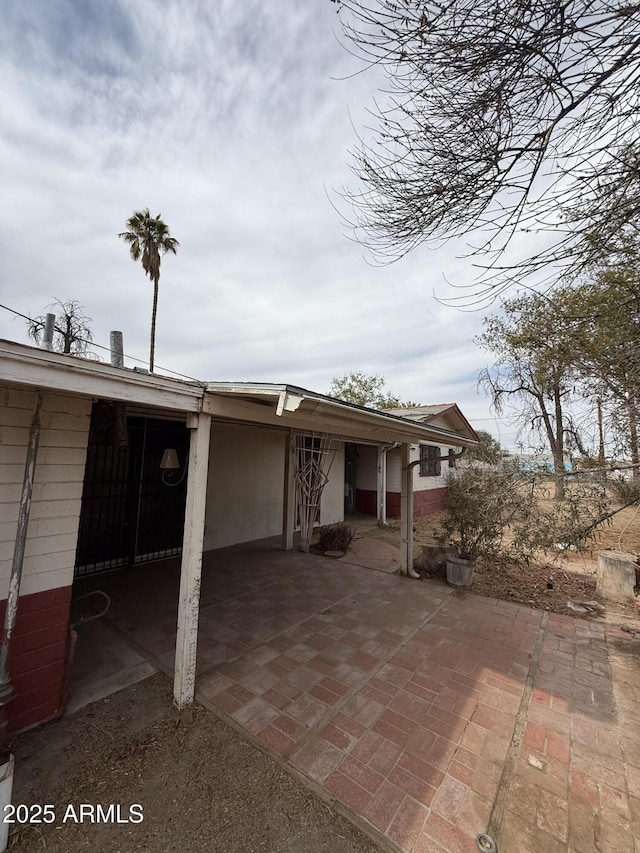 back of property with a patio