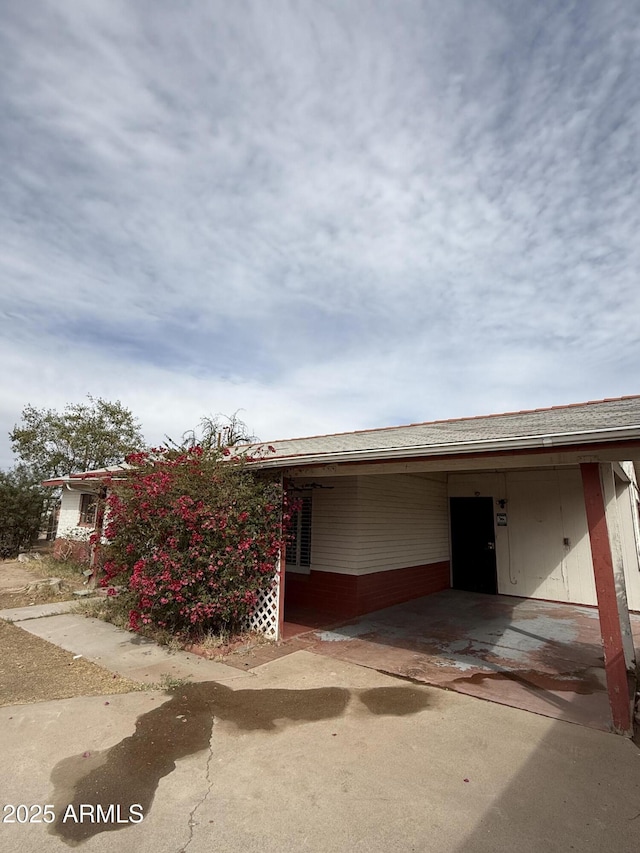 view of front of property with an attached carport