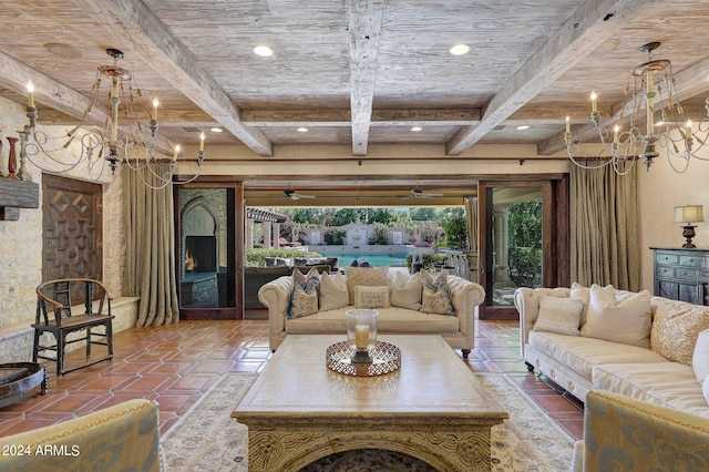 living room featuring beamed ceiling and an inviting chandelier