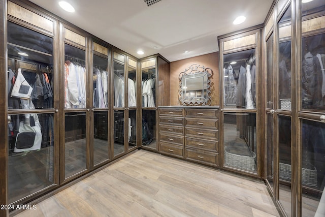 spacious closet with light hardwood / wood-style floors