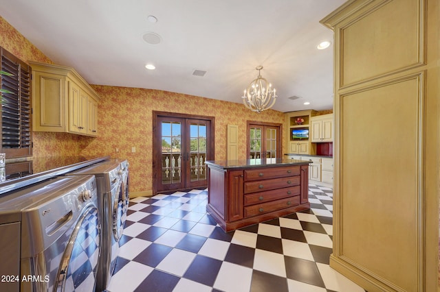 kitchen with french doors, washer and dryer, a chandelier, and decorative light fixtures