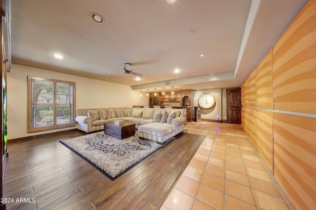 living room with ceiling fan and wood-type flooring