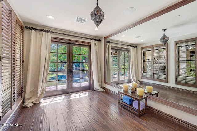 unfurnished sunroom featuring french doors