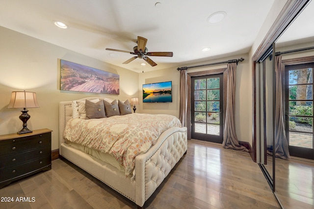 bedroom with ceiling fan, wood-type flooring, and access to exterior