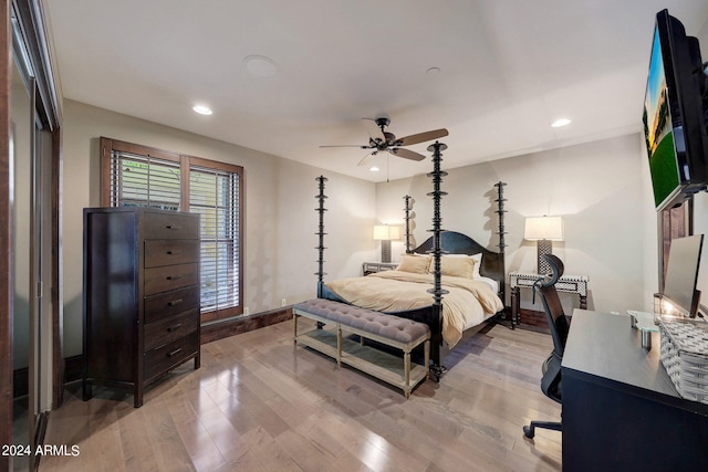 bedroom with ceiling fan and light wood-type flooring