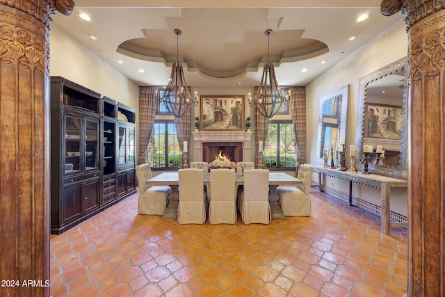 dining room with a wealth of natural light and a tray ceiling