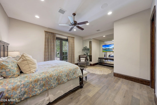 bedroom featuring french doors, wood-type flooring, and ceiling fan