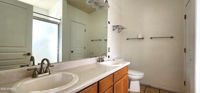 bathroom featuring tile patterned floors, vanity, and toilet