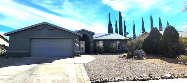 ranch-style home featuring a garage