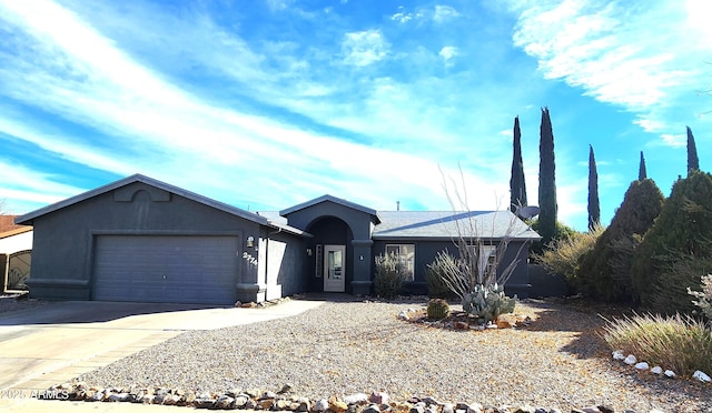 ranch-style house featuring a garage