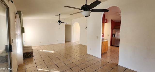 interior space with ceiling fan and light tile patterned flooring