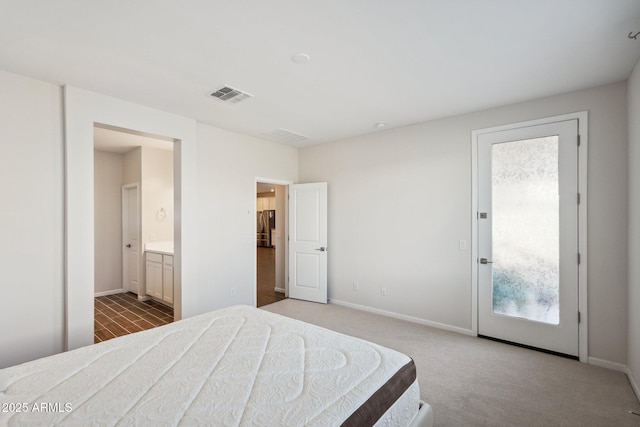 carpeted bedroom featuring access to exterior, baseboards, visible vents, and freestanding refrigerator