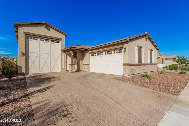 mediterranean / spanish house with a garage