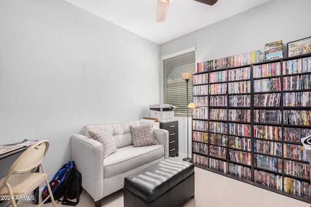 sitting room with carpet floors and ceiling fan