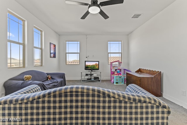 bedroom with ceiling fan, carpet, visible vents, and baseboards