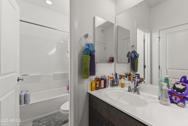 full bath featuring toilet, shower / washtub combination, and vanity