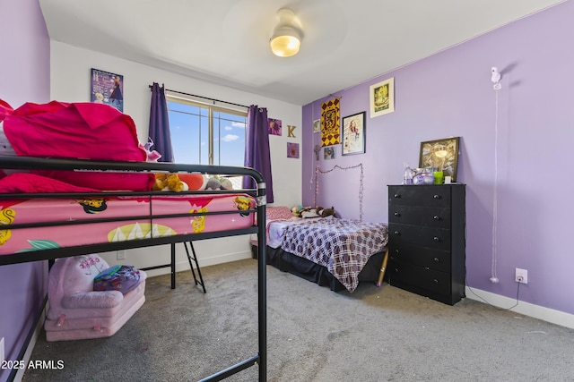 carpeted bedroom featuring baseboards