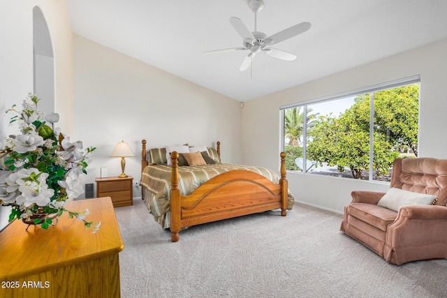 carpeted bedroom featuring ceiling fan and lofted ceiling