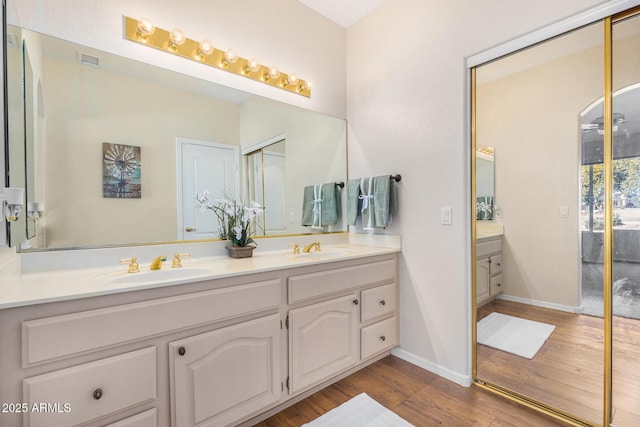 bathroom featuring vanity and hardwood / wood-style flooring