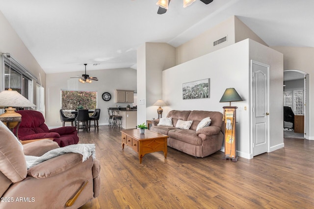 living room featuring dark hardwood / wood-style flooring, vaulted ceiling, and ceiling fan