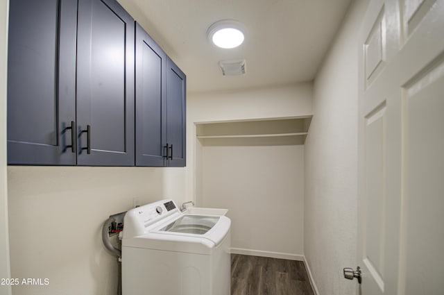 washroom with cabinets, sink, washer / dryer, and dark wood-type flooring