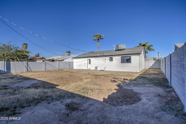 rear view of property with central air condition unit