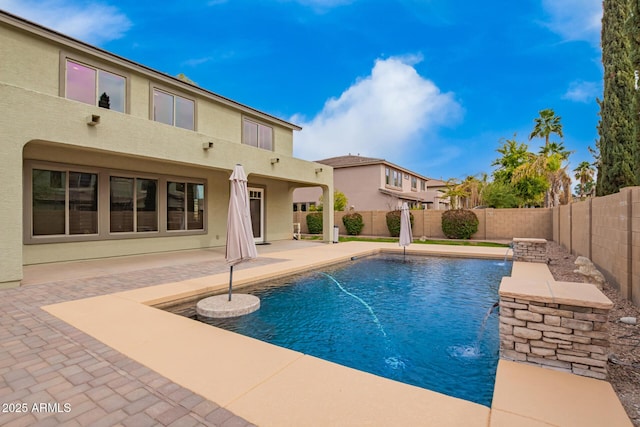 view of swimming pool featuring pool water feature and a patio area