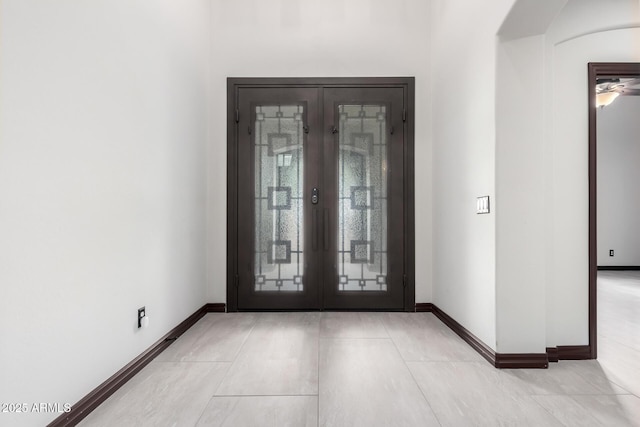 tiled entrance foyer with french doors