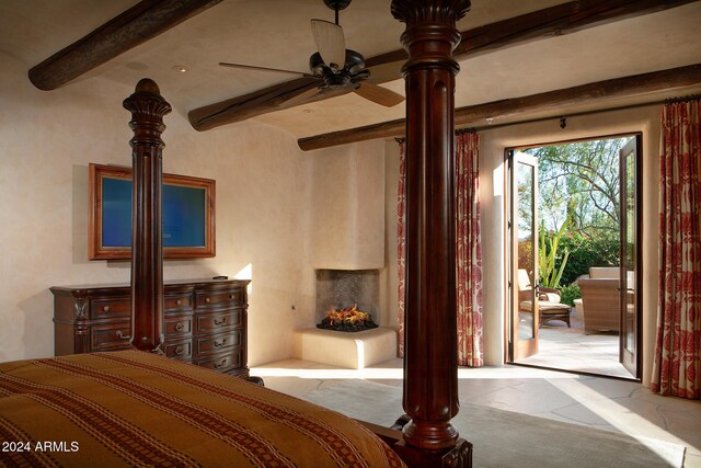 bedroom featuring beam ceiling and ceiling fan