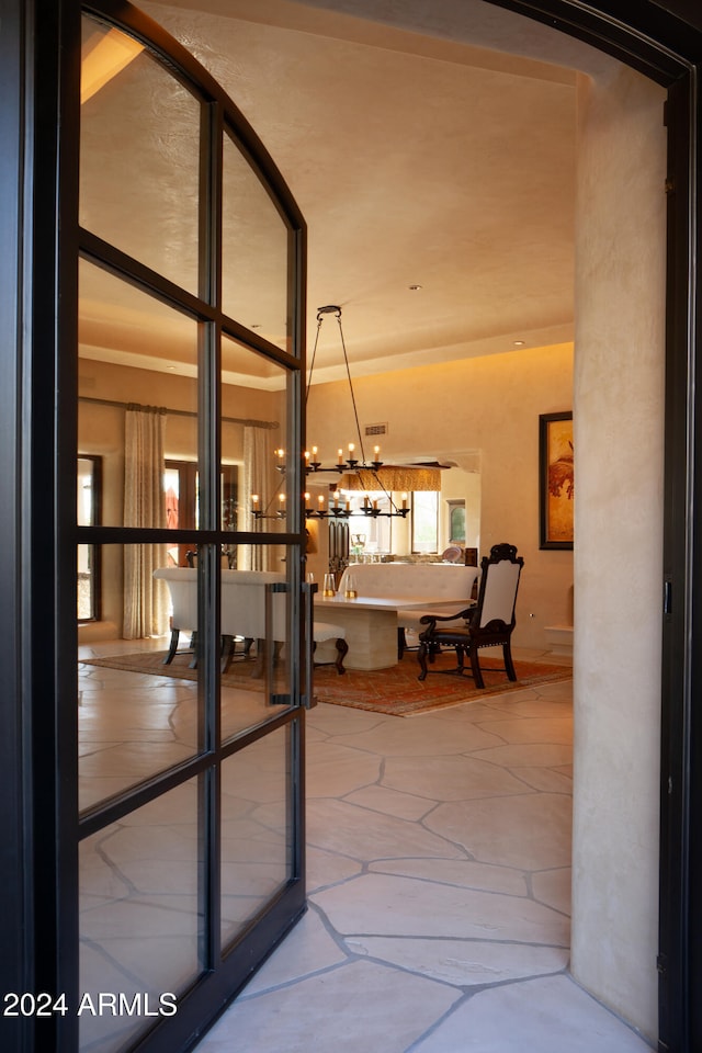 interior space featuring an inviting chandelier