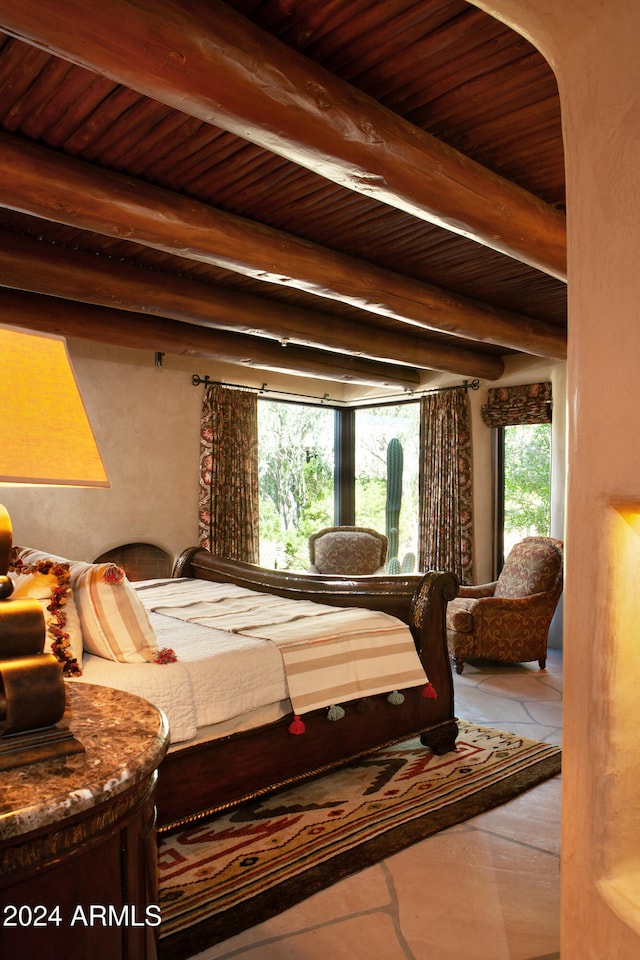 bedroom featuring beam ceiling and wooden ceiling