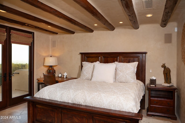 bedroom featuring beam ceiling and access to outside