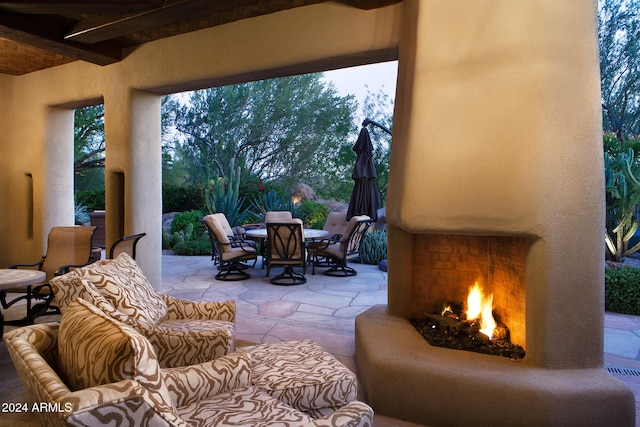 view of patio / terrace with an outdoor fireplace