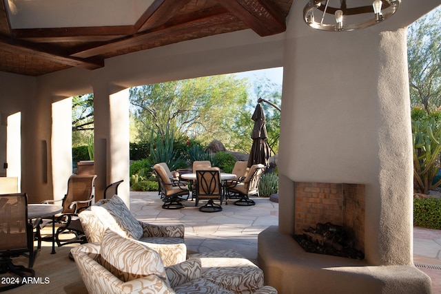 view of patio featuring exterior fireplace