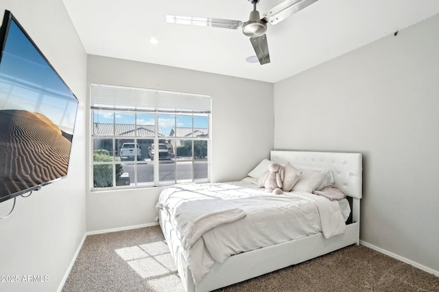 bedroom with carpet flooring, baseboards, and a ceiling fan