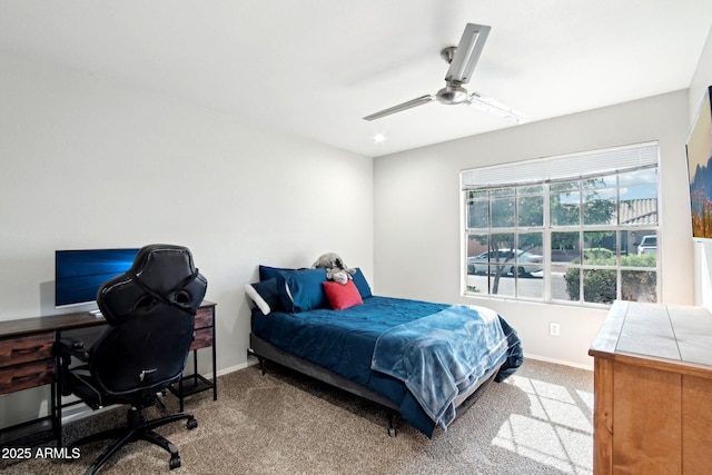 bedroom with carpet flooring, baseboards, and a ceiling fan
