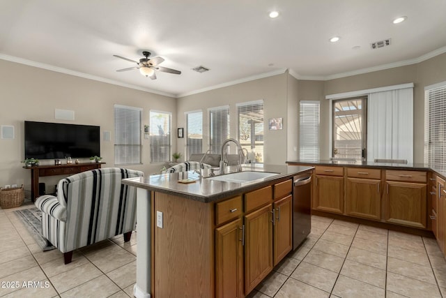 kitchen featuring light tile patterned flooring, dishwasher, sink, ornamental molding, and a kitchen island with sink