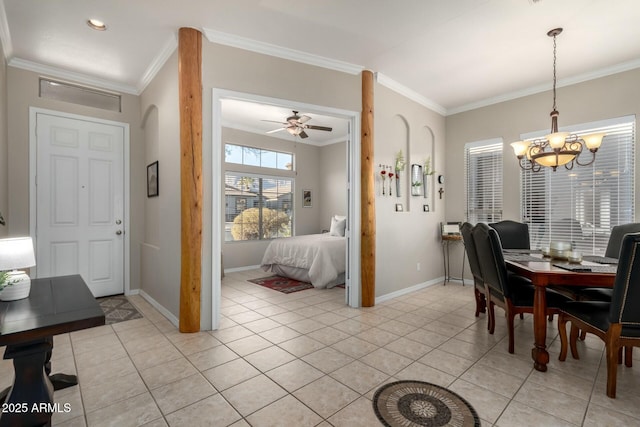 tiled dining room with ornamental molding and ceiling fan with notable chandelier