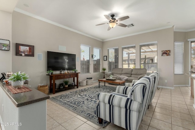 living room with light tile patterned floors, ornamental molding, and ceiling fan