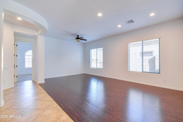 spare room with ceiling fan and light hardwood / wood-style flooring