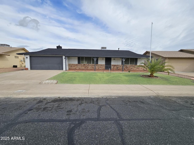 ranch-style home featuring a garage, brick siding, concrete driveway, and a front lawn