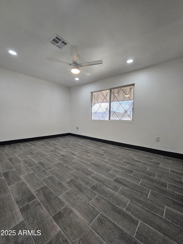 empty room with visible vents, wood finish floors, baseboards, recessed lighting, and a ceiling fan