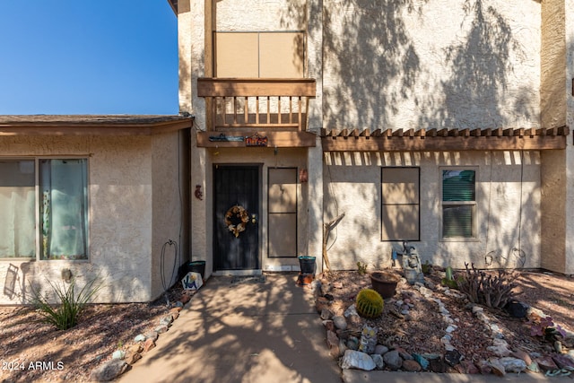 entrance to property with a balcony