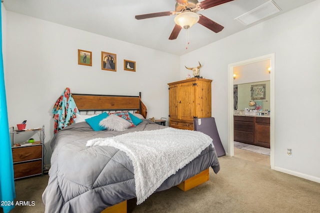 bedroom featuring ensuite bathroom, ceiling fan, and carpet flooring