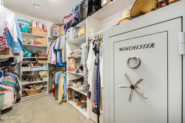 walk in closet featuring carpet and visible vents