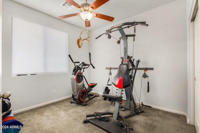 workout area featuring carpet flooring, baseboards, visible vents, and a ceiling fan